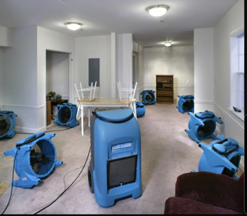 Air movers and dehumidifier setup for Water Damage Restoration in Monona